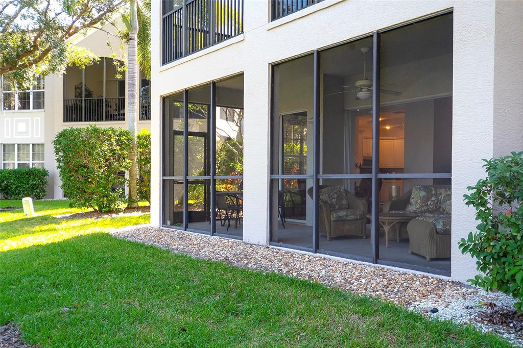 5264 Bouchard Circle, Unit 102 Sarasota, FL 34238 - Photo 21 of 32 a view of an house with backyard space and garden