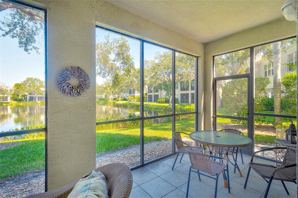 5264 Bouchard Circle, Unit 102 Sarasota, FL 34238 - Photo 22 of 32 a view of a room with furniture and backyard