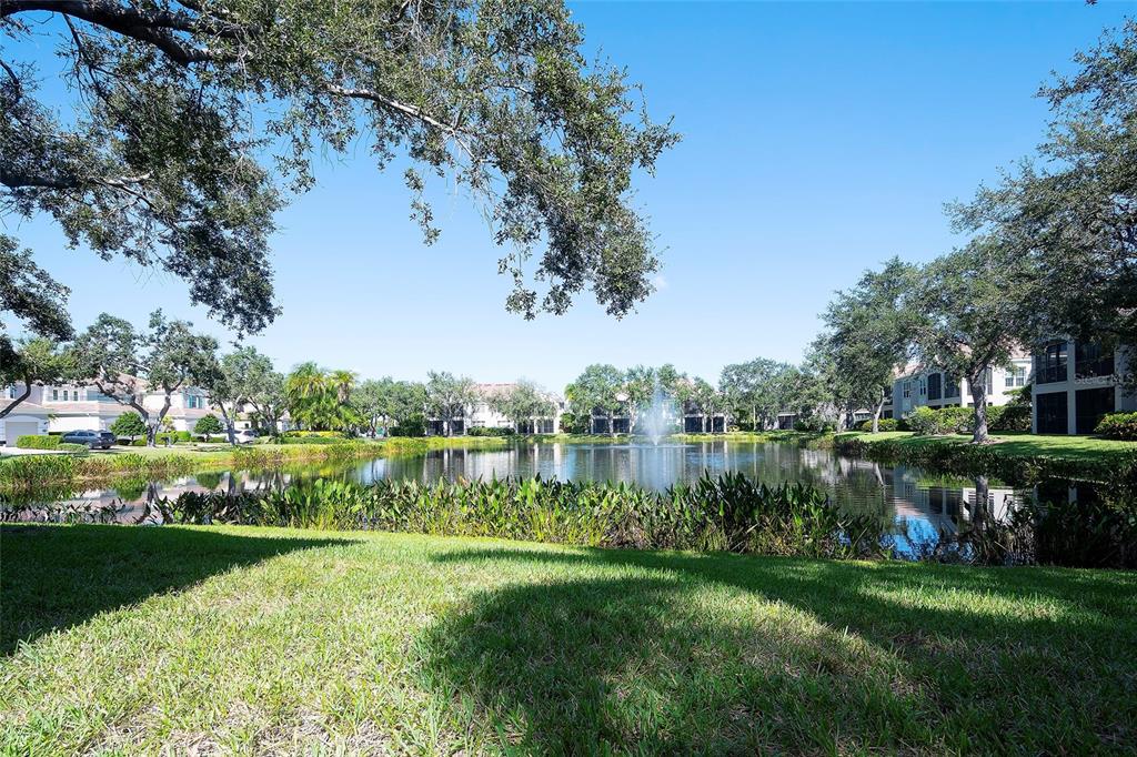 5264 Bouchard Circle, Unit 102 Sarasota, FL 34238 - Photo 24 of 32 a view of a lake with houses in the back
