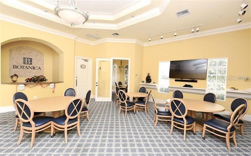 5264 Bouchard Circle, Unit 102 Sarasota, FL 34238 - Photo 27 of 32 a view of a dining room with furniture