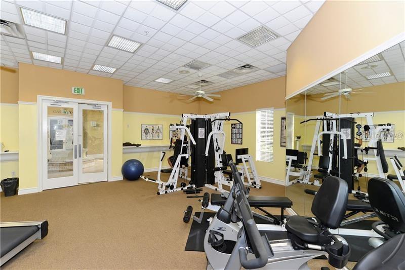 5264 Bouchard Circle, Unit 102 Sarasota, FL 34238 - Photo 28 of 32 a view of a room with gym equipment