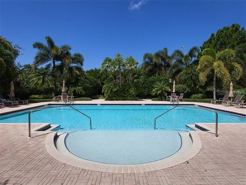 5264 Bouchard Circle, Unit 102 Sarasota, FL 34238 - Photo 31 of 32 a view of a swimming pool with a patio