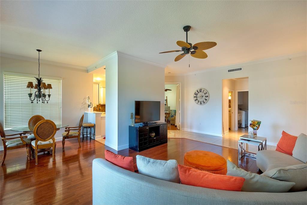 5264 Bouchard Circle, Unit 102 Sarasota, FL 34238 - Photo 7 of 32 a living room with furniture and a flat screen tv