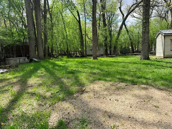 a view of backyard with green space