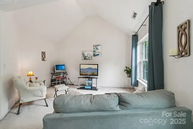 a living room with furniture and a couch