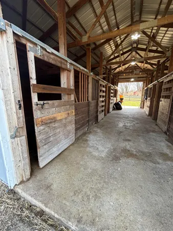 a view of empty room with wooden walls
