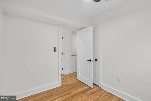 a view of a bathroom with wooden floor