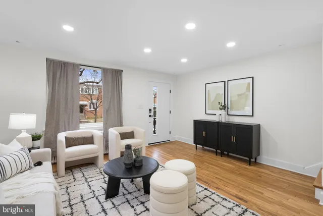 a living room with furniture and a bathroom