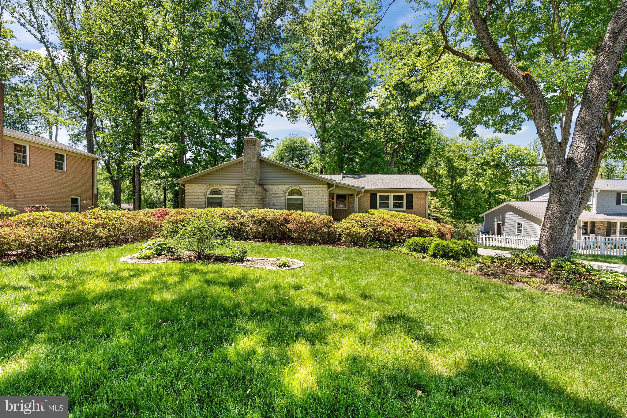 6604 Grey Fox Drive Springfield, VA 22152 - Photo 1 of 46 a house view with a garden space