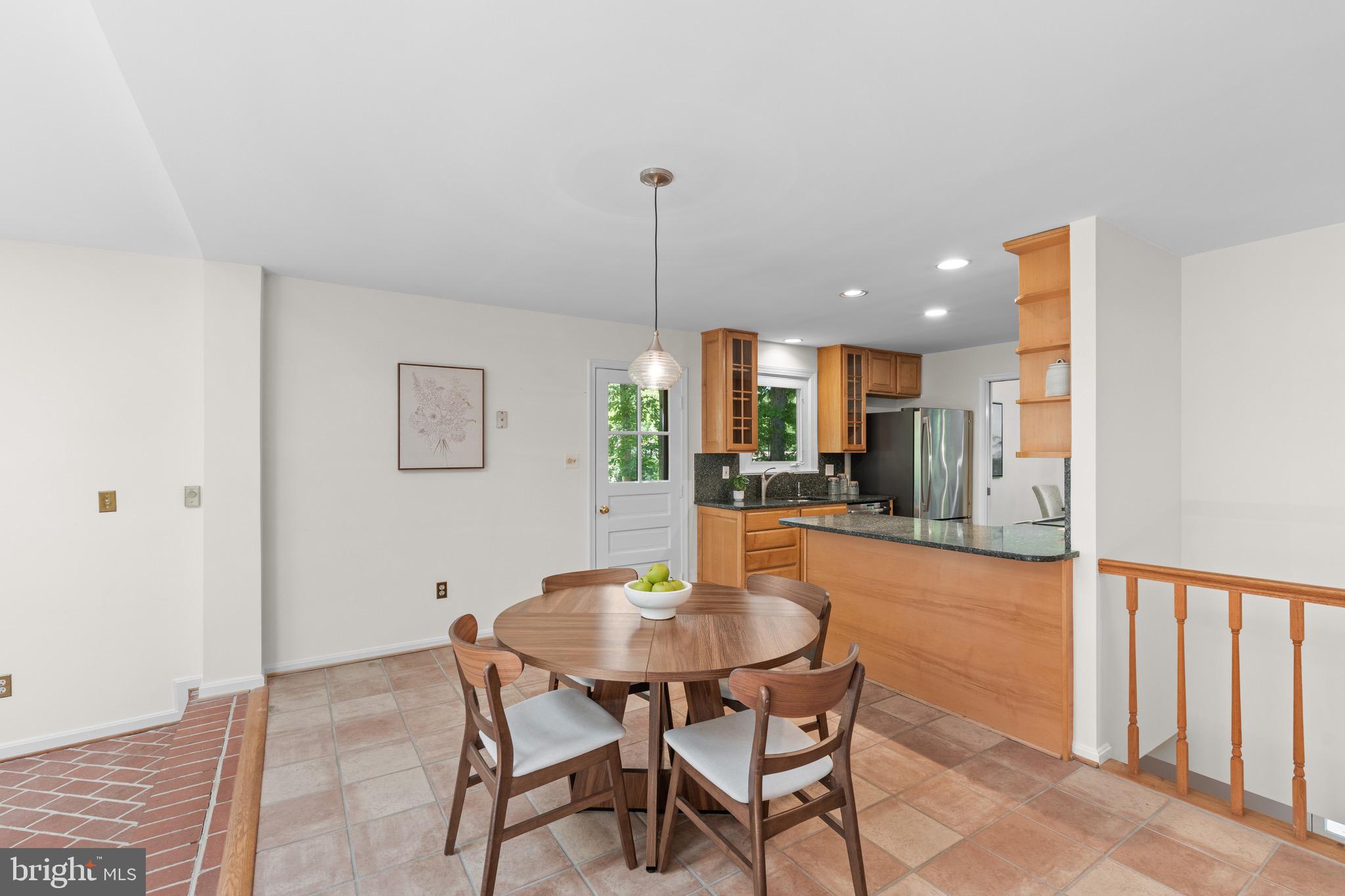 6604 Grey Fox Drive Springfield, VA 22152 - Photo 12 of 46 a dining room with furniture and window