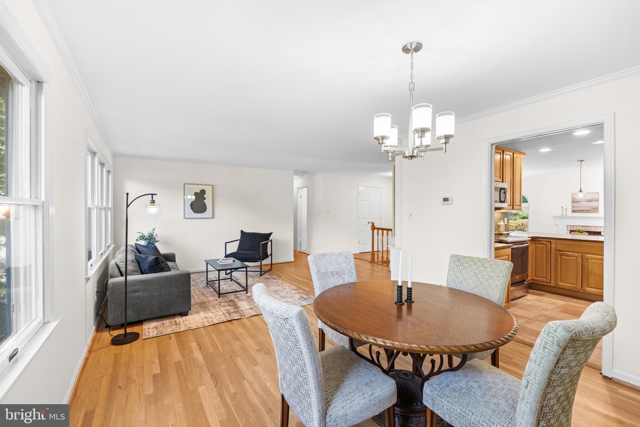 6604 Grey Fox Drive Springfield, VA 22152 - Photo 16 of 46 a view of a dining room with furniture and wooden floor