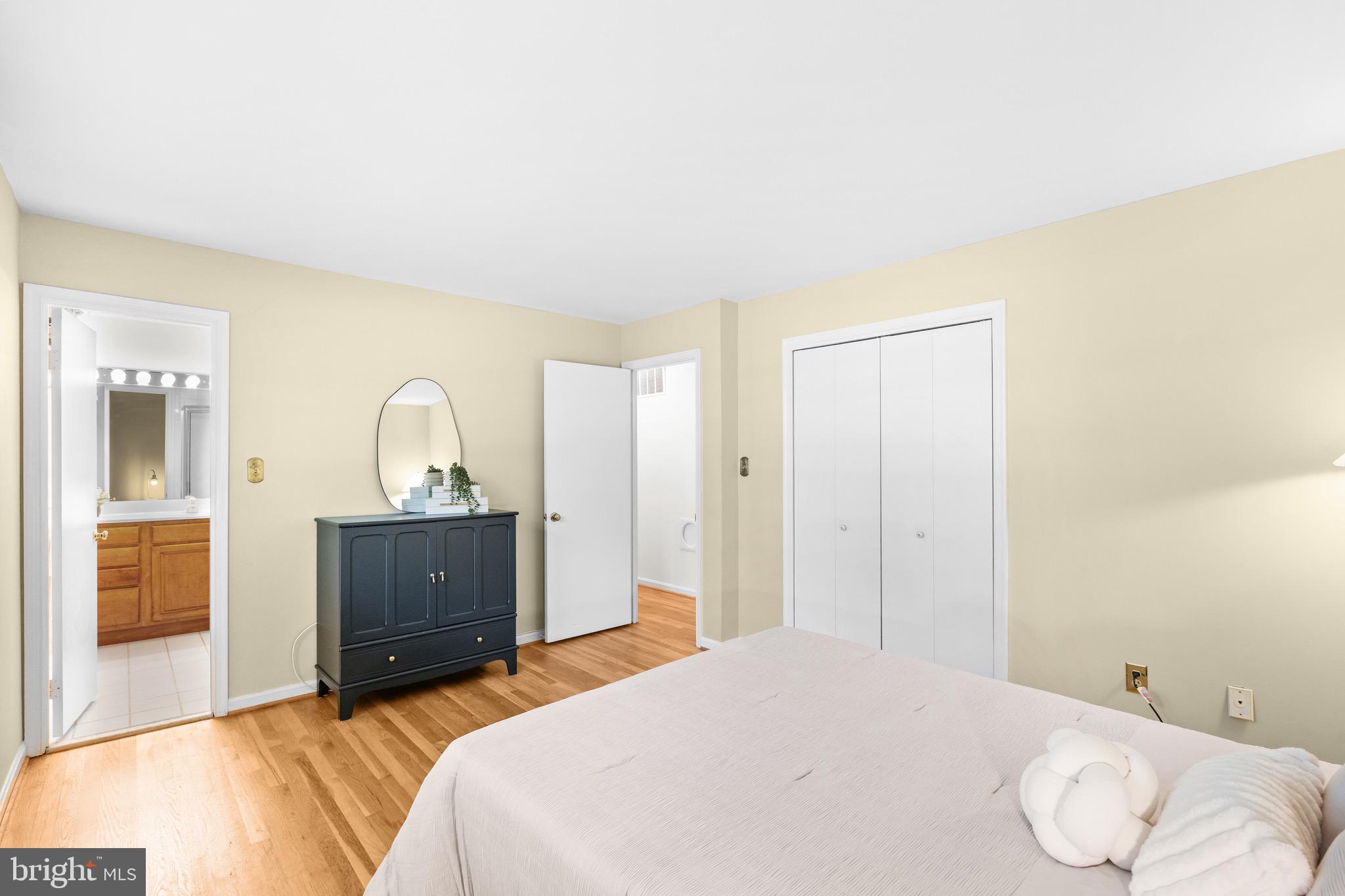 6604 Grey Fox Drive Springfield, VA 22152 - Photo 20 of 46 a bedroom with a bed and a dresser
