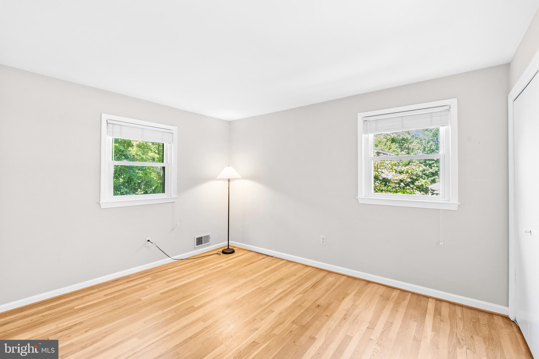 6604 Grey Fox Drive Springfield, VA 22152 - Photo 23 of 46 a view of a bedroom with wooden floor and a window