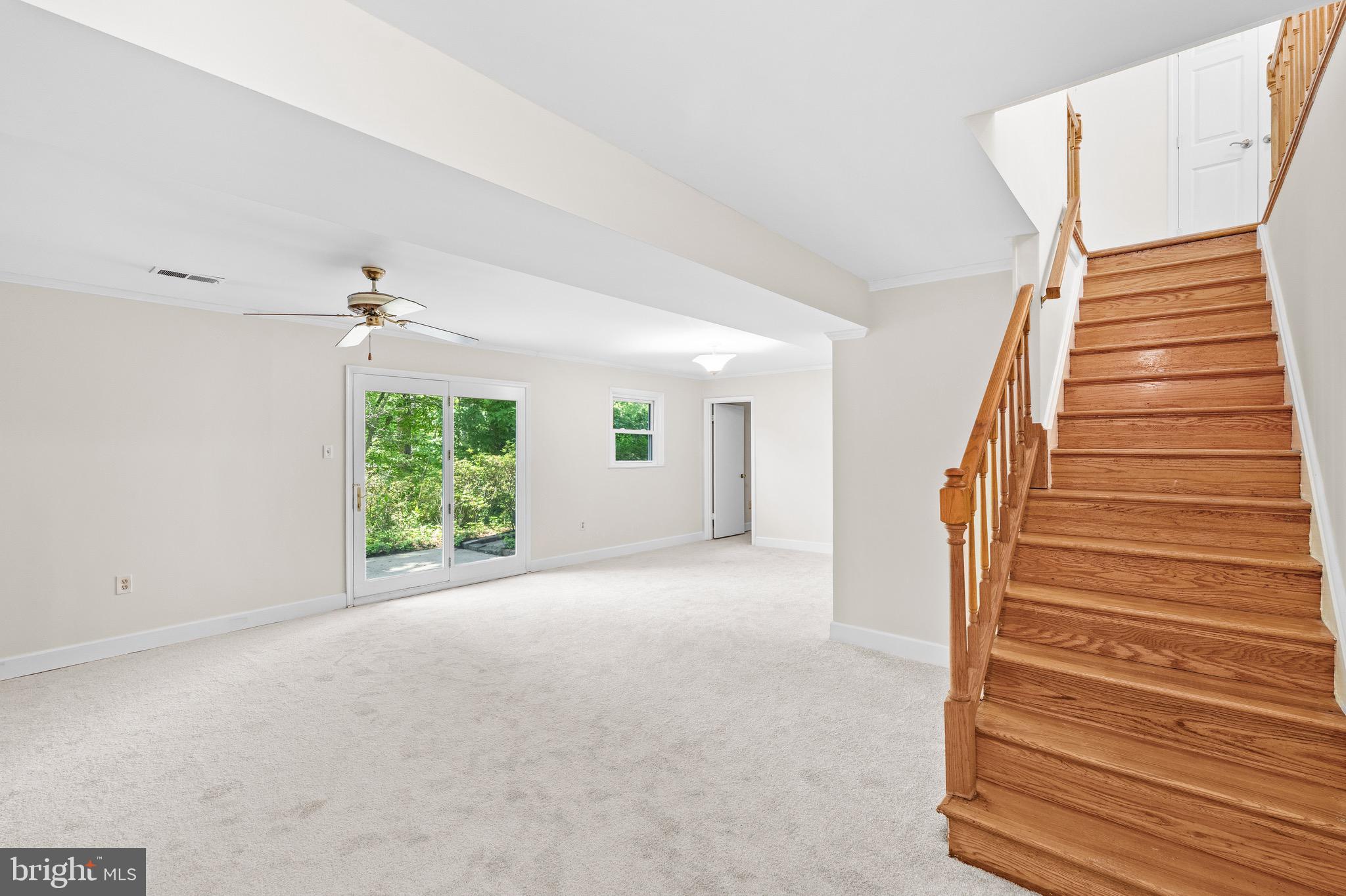 6604 Grey Fox Drive Springfield, VA 22152 - Photo 30 of 46 a view of a room with wooden floor and windows