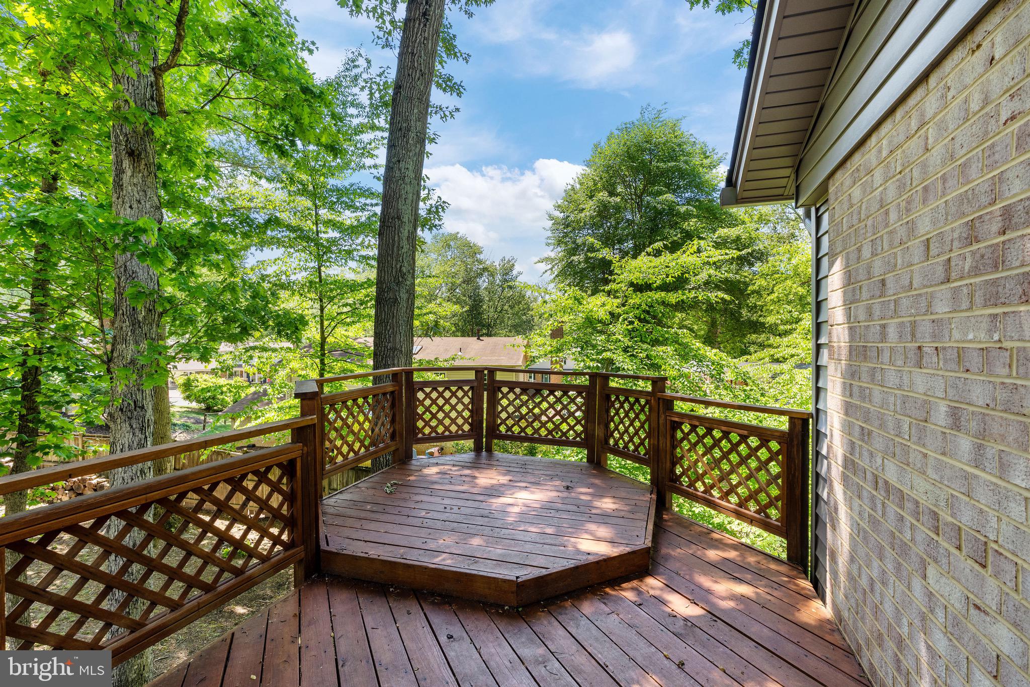 6604 Grey Fox Drive Springfield, VA 22152 - Photo 41 of 46 a view of a wooden deck with a bench
