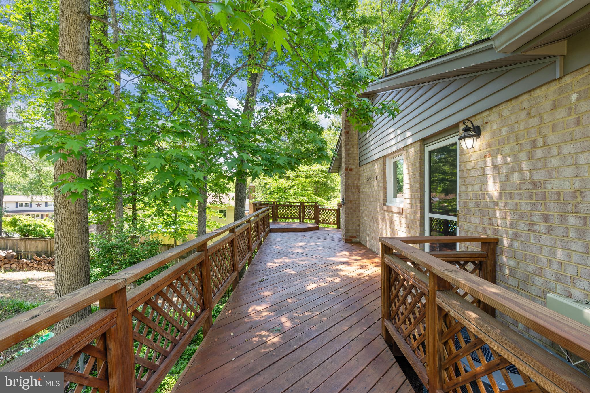 6604 Grey Fox Drive Springfield, VA 22152 - Photo 43 of 46 a view of balcony with wooden floor and fence
