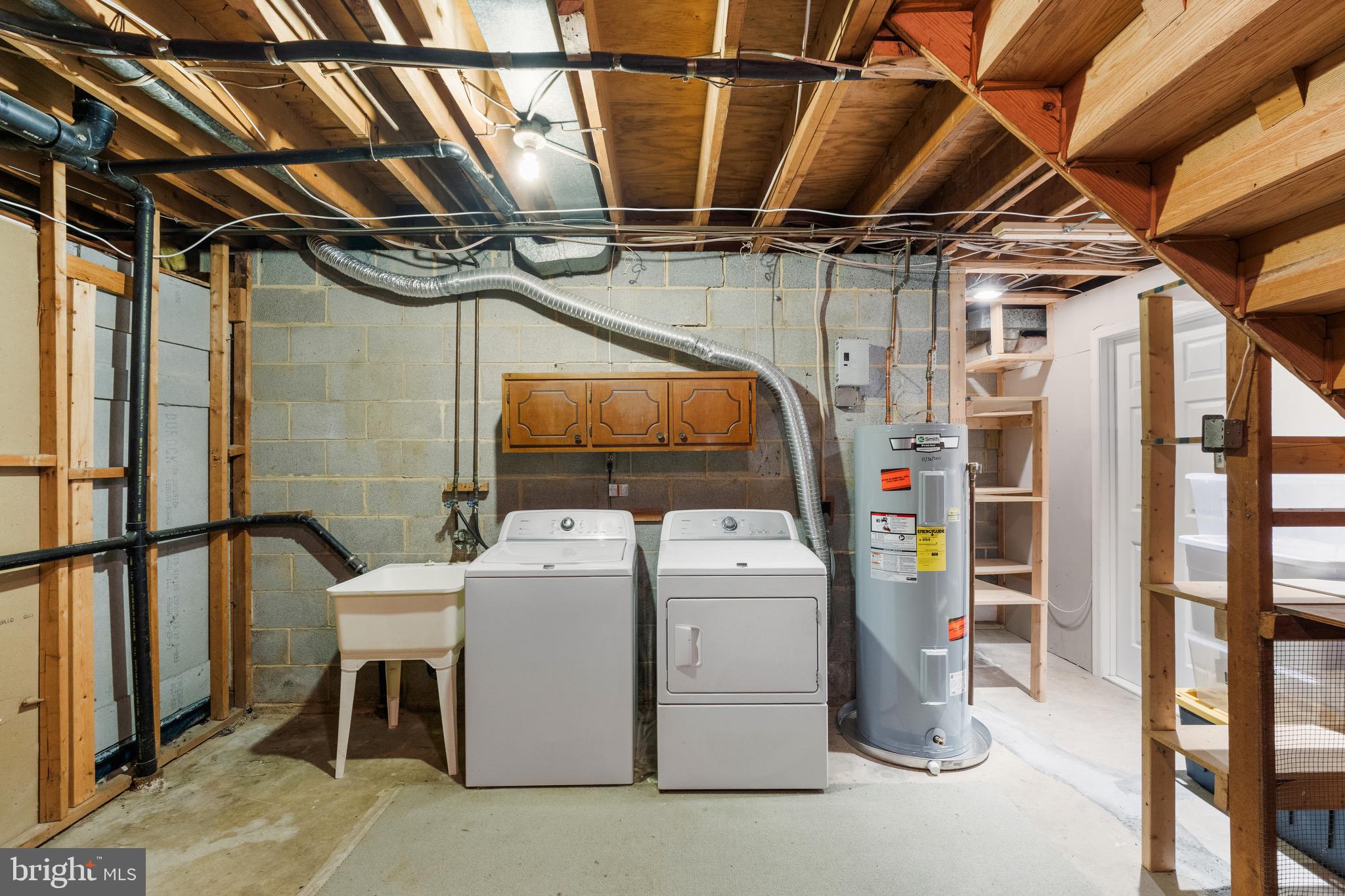 6604 Grey Fox Drive Springfield, VA 22152 - Photo 45 of 46 a utility room with dryer and washer