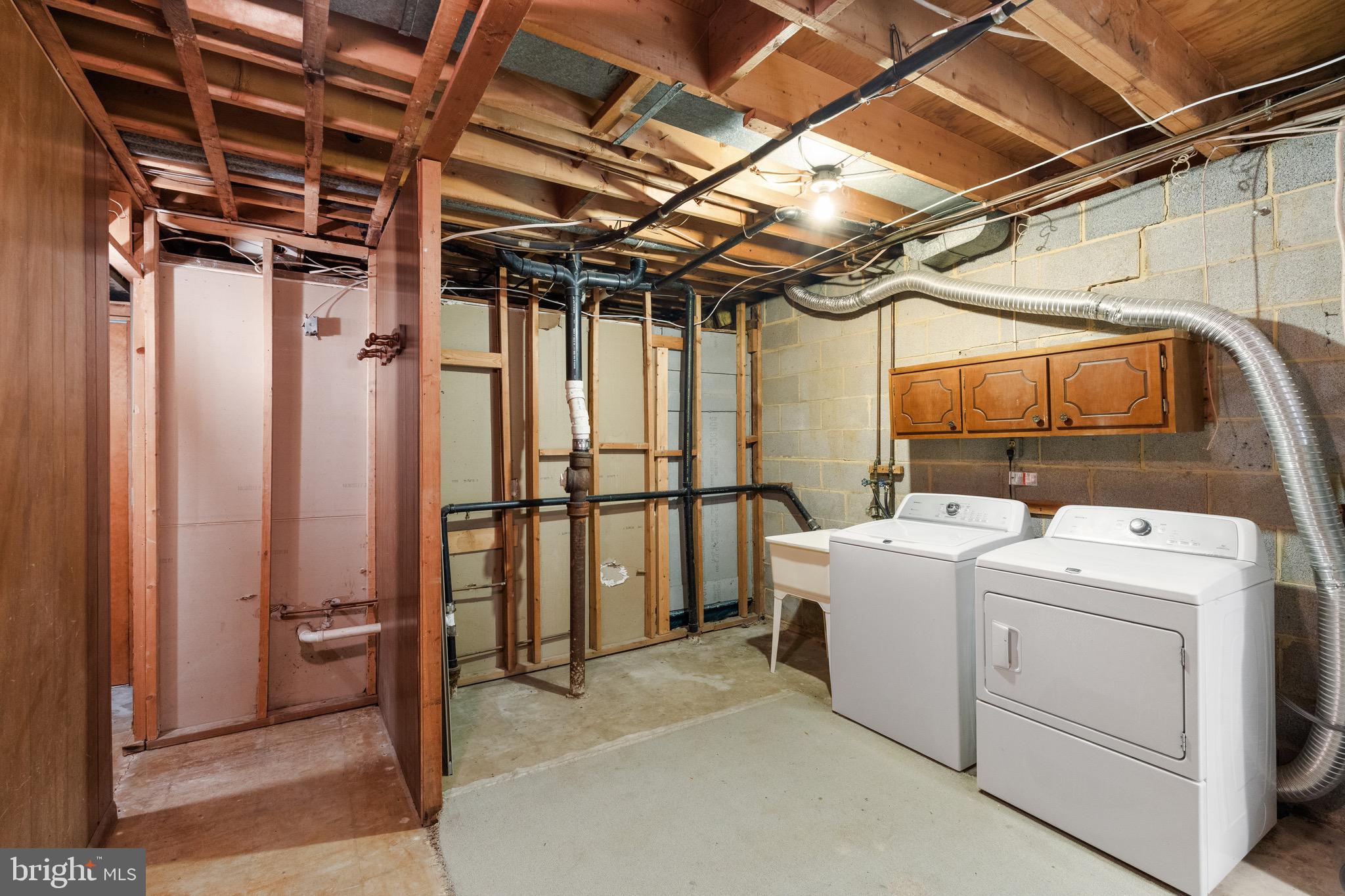 6604 Grey Fox Drive Springfield, VA 22152 - Photo 46 of 46 a utility room with dryer and washer