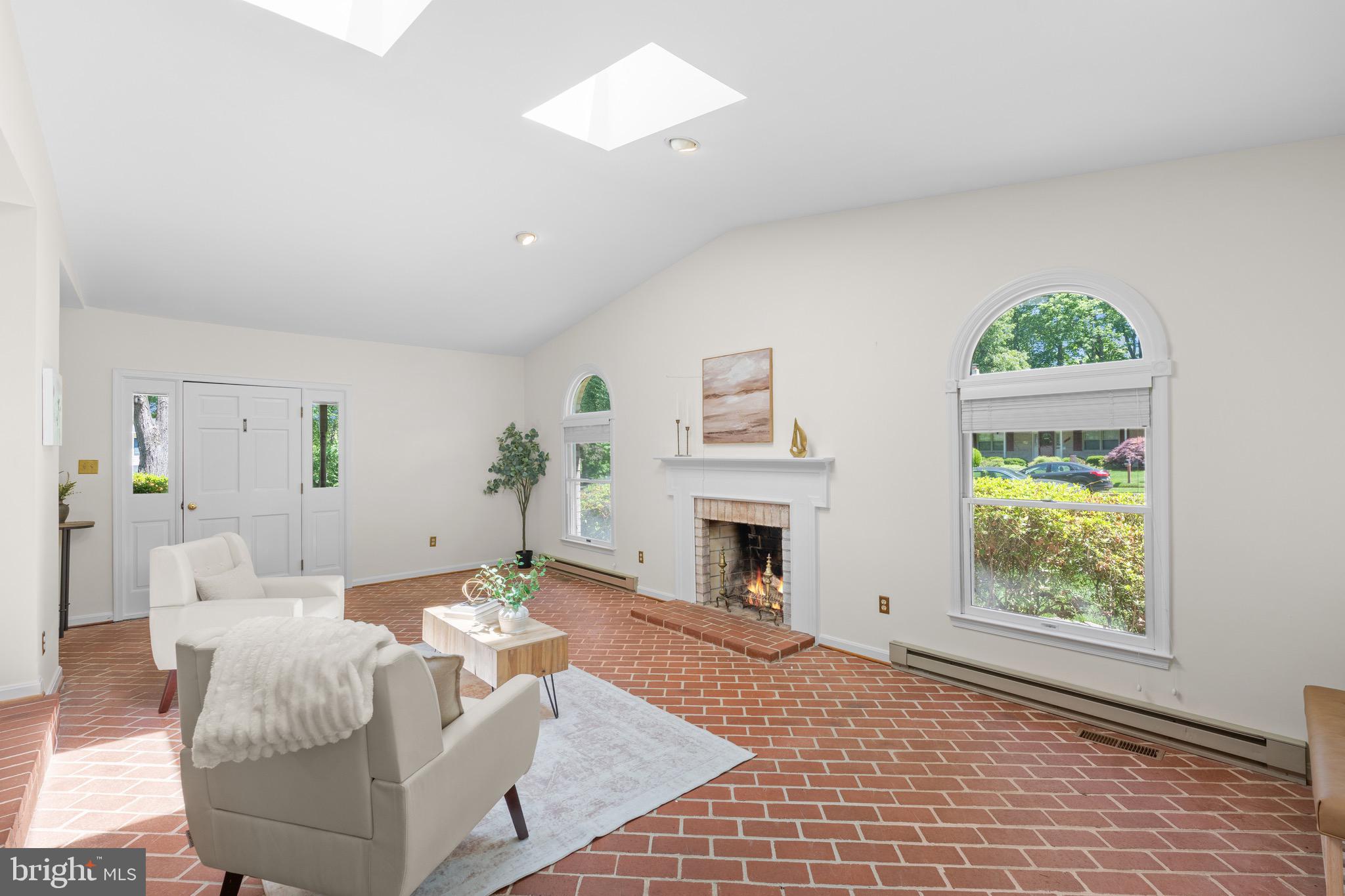 6604 Grey Fox Drive Springfield, VA 22152 - Photo 6 of 46 a living room with furniture a fireplace and a window