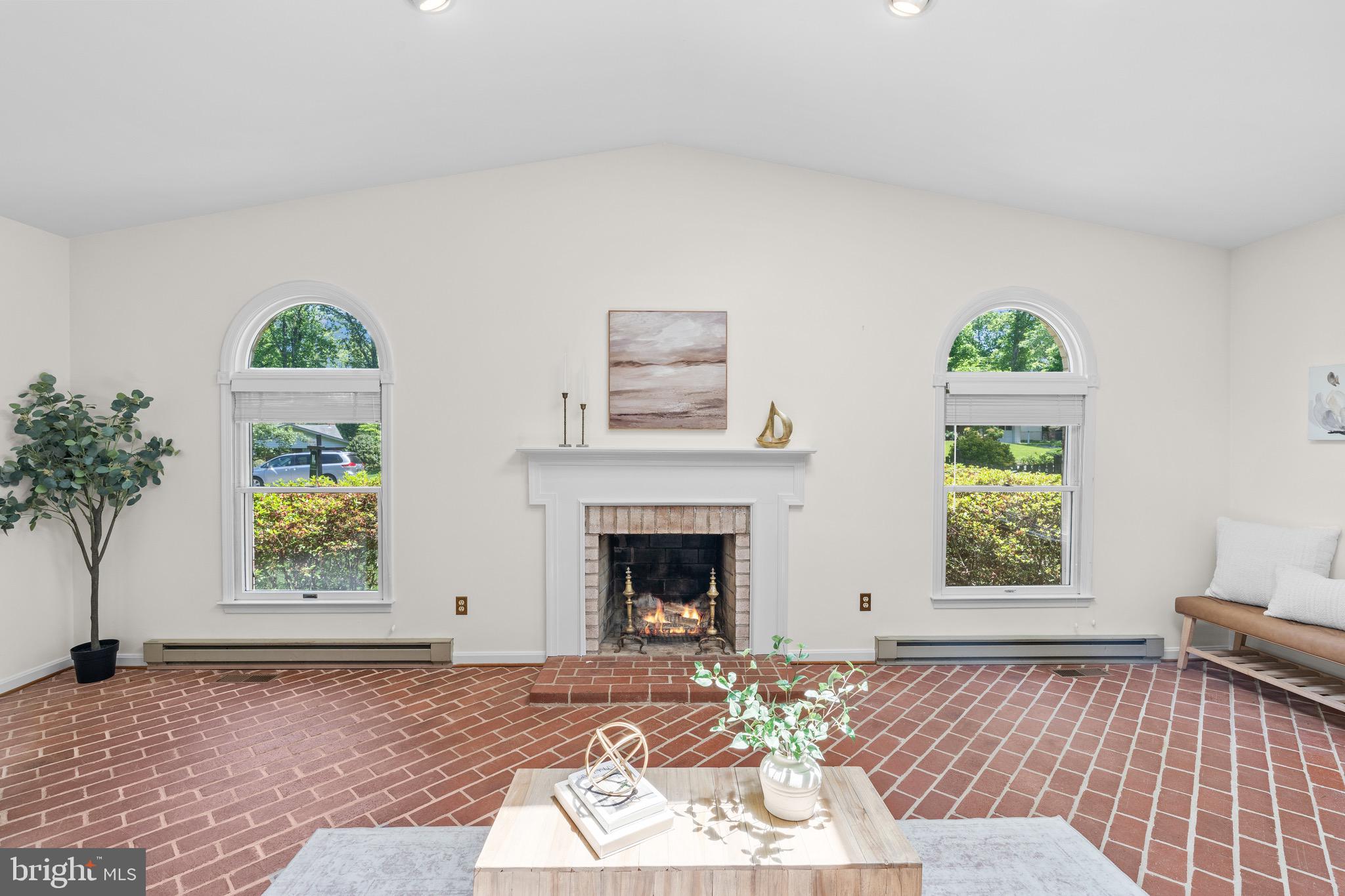 6604 Grey Fox Drive Springfield, VA 22152 - Photo 7 of 46 a living room with a couch a window and a fireplace