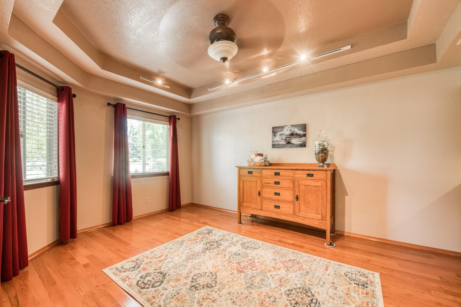 19408 Farallon Road Madera, CA 93638 - Photo 11 of 62 a view of room with window and wooden floor