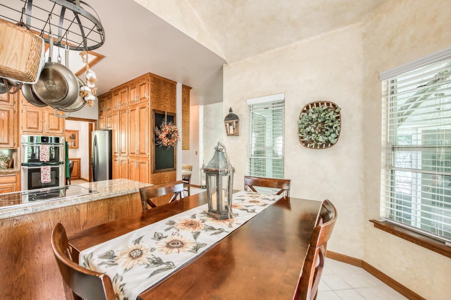 19408 Farallon Road Madera, CA 93638 - Photo 21 of 62 a view of a dining room with furniture window and wooden floor
