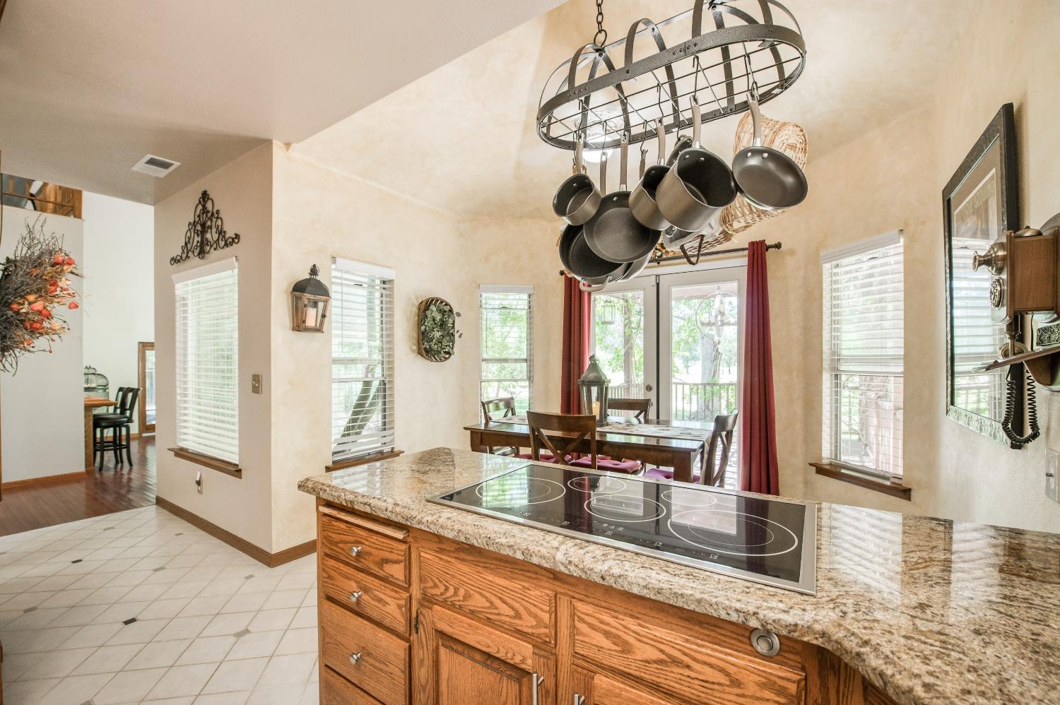 19408 Farallon Road Madera, CA 93638 - Photo 25 of 62 a kitchen with stainless steel appliances granite countertop a sink a window and stainless steel appliances