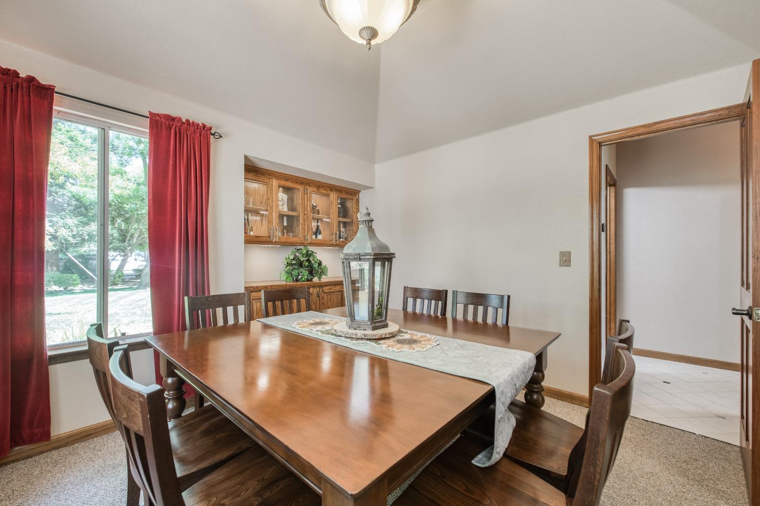 19408 Farallon Road Madera, CA 93638 - Photo 27 of 62 a view of a dining room with furniture window and outside view