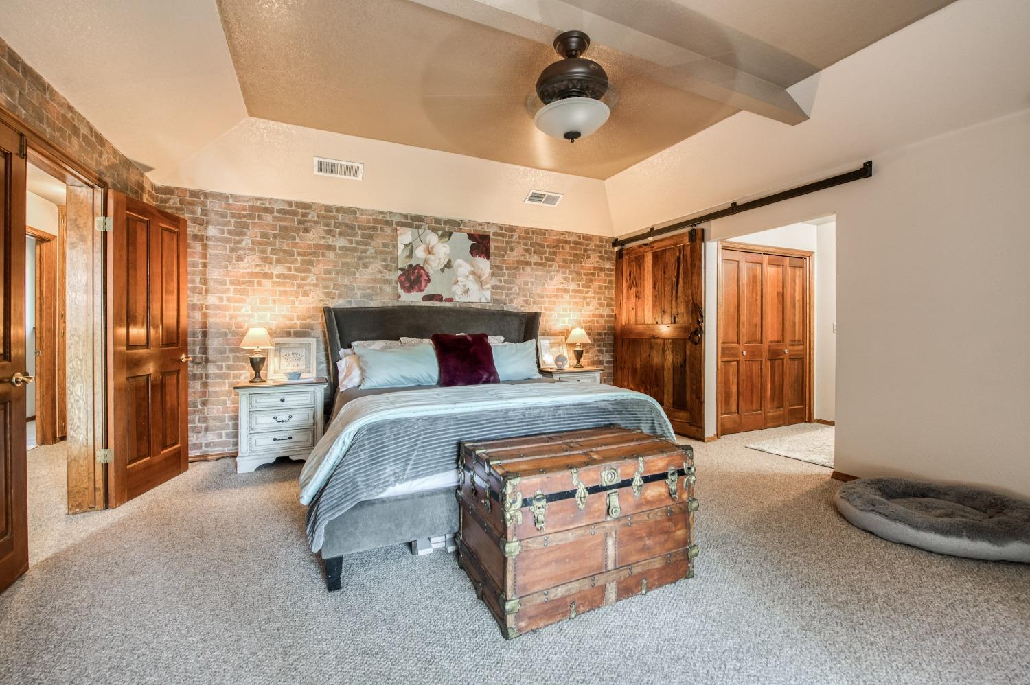 19408 Farallon Road Madera, CA 93638 - Photo 41 of 62 a bedroom with a bed and a large window