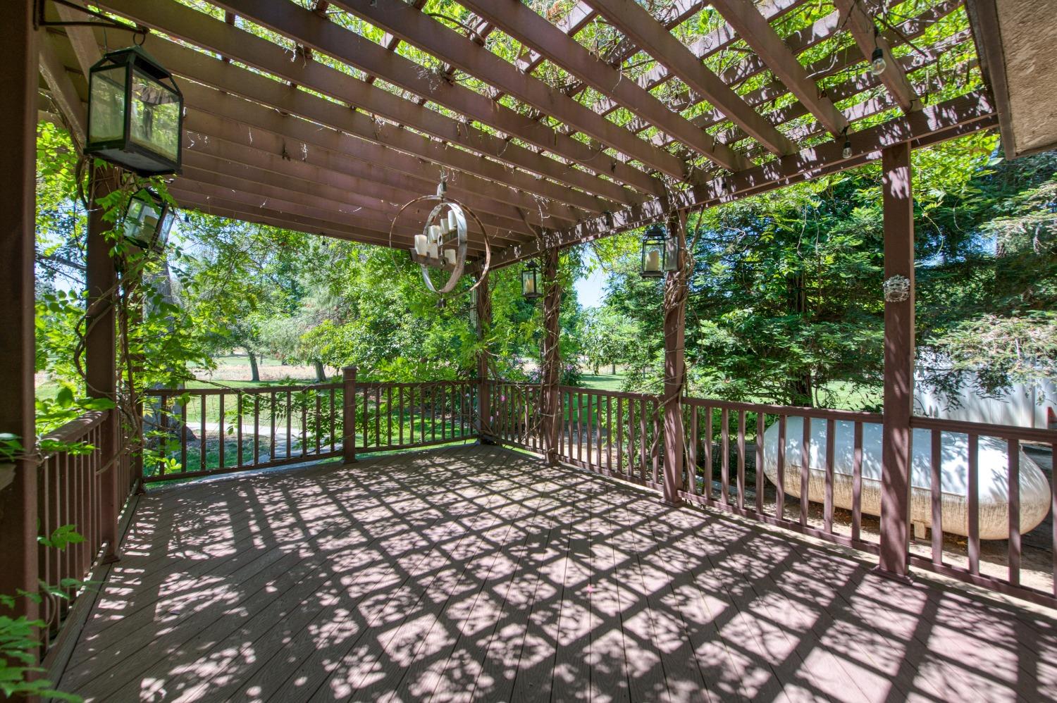 19408 Farallon Road Madera, CA 93638 - Photo 46 of 62 a balcony with trees in front of it