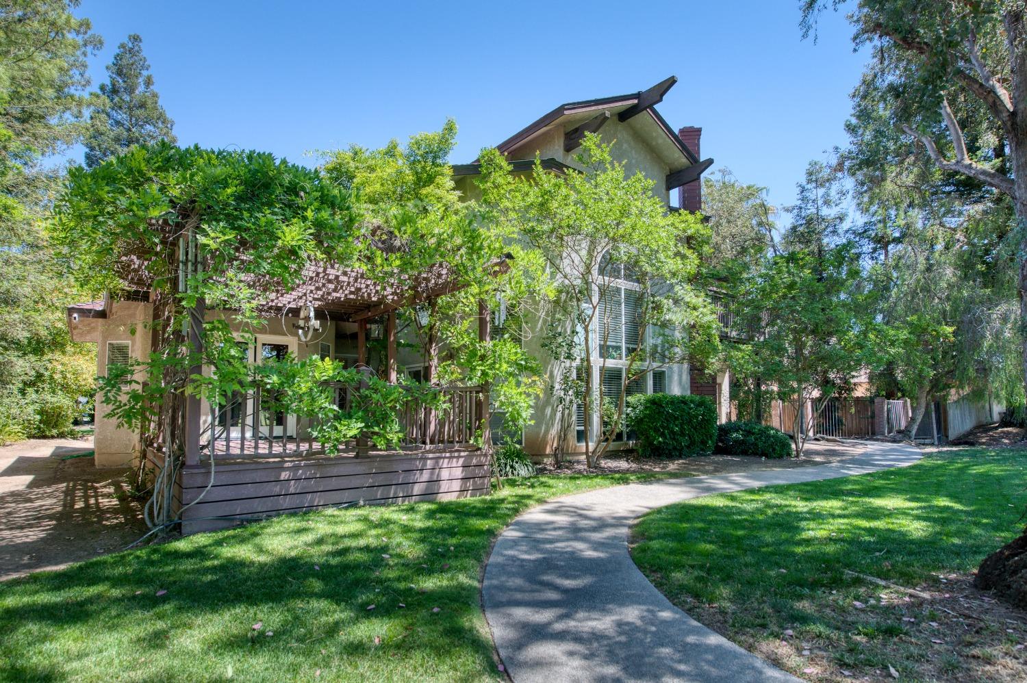 19408 Farallon Road Madera, CA 93638 - Photo 50 of 62 a view of a yard with plants and trees
