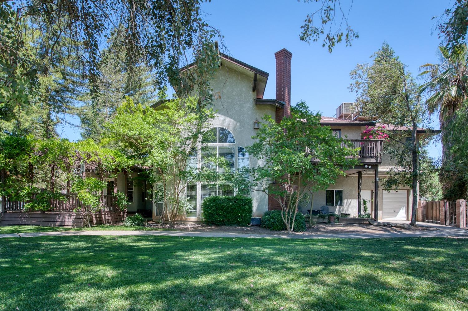 19408 Farallon Road Madera, CA 93638 - Photo 52 of 62 front view of a house with a tree