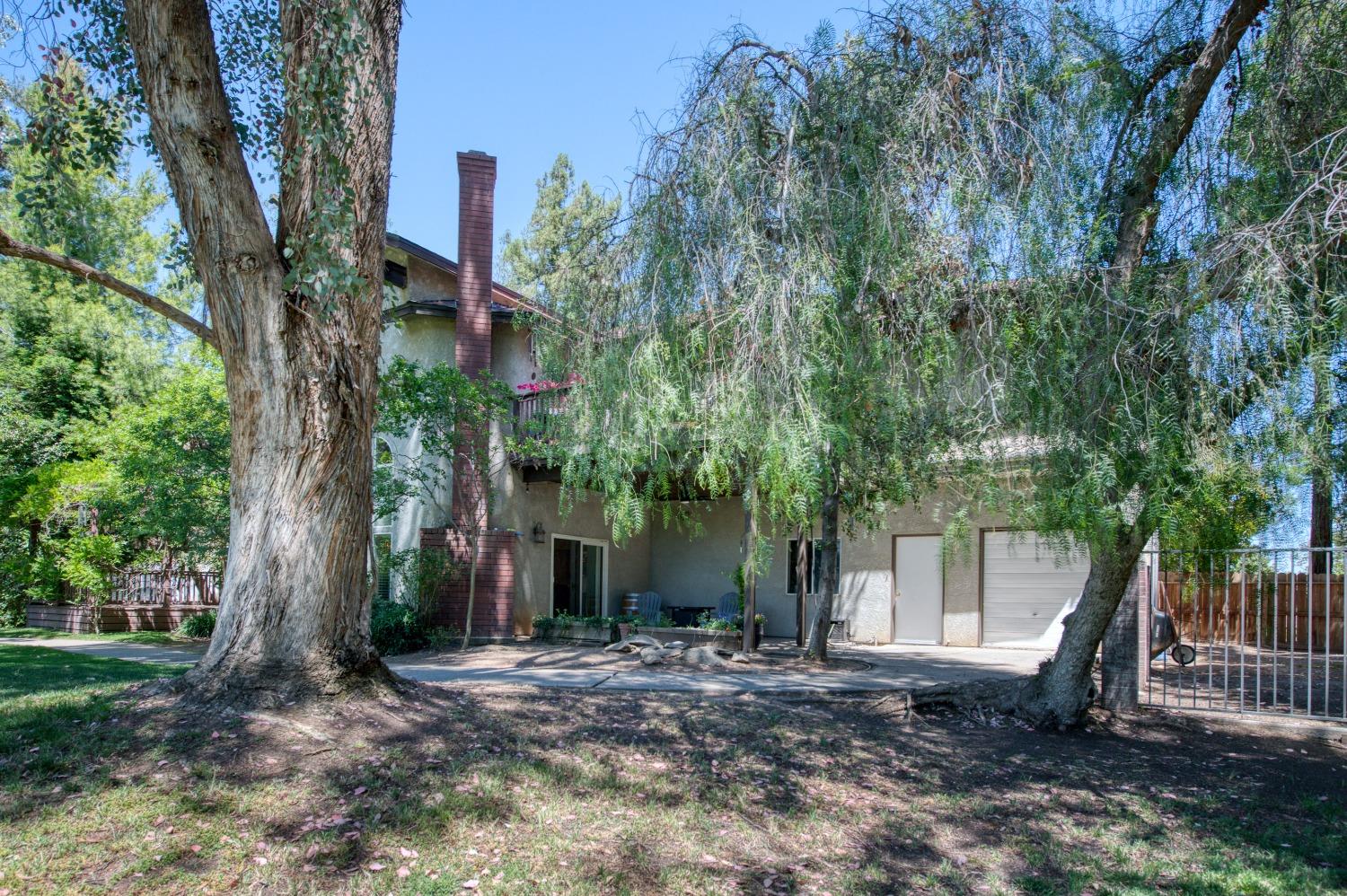 19408 Farallon Road Madera, CA 93638 - Photo 55 of 62 a view of a house with a tree in front