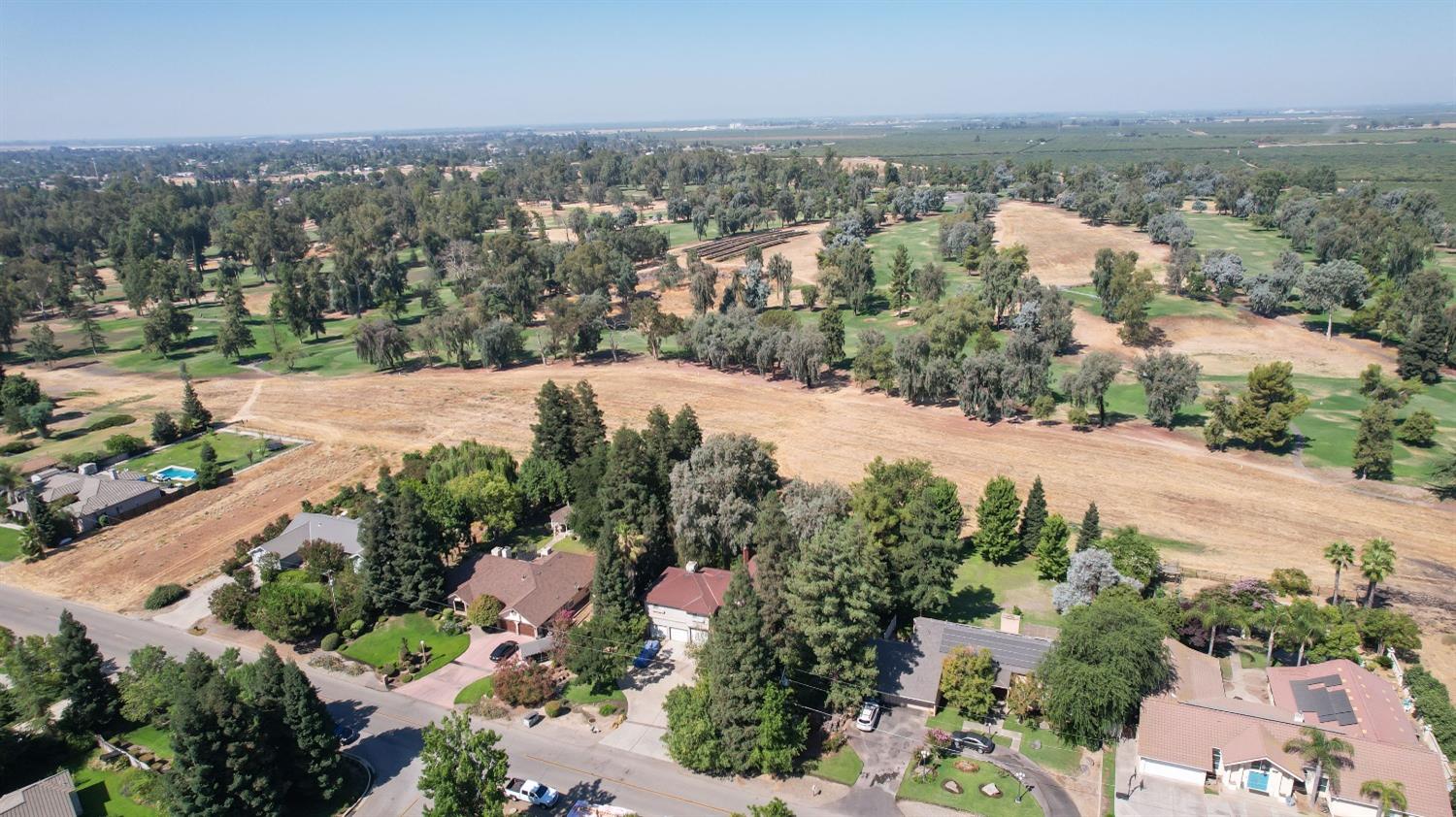 19408 Farallon Road Madera, CA 93638 - Photo 60 of 62 an aerial view of a city with lots of residential buildings