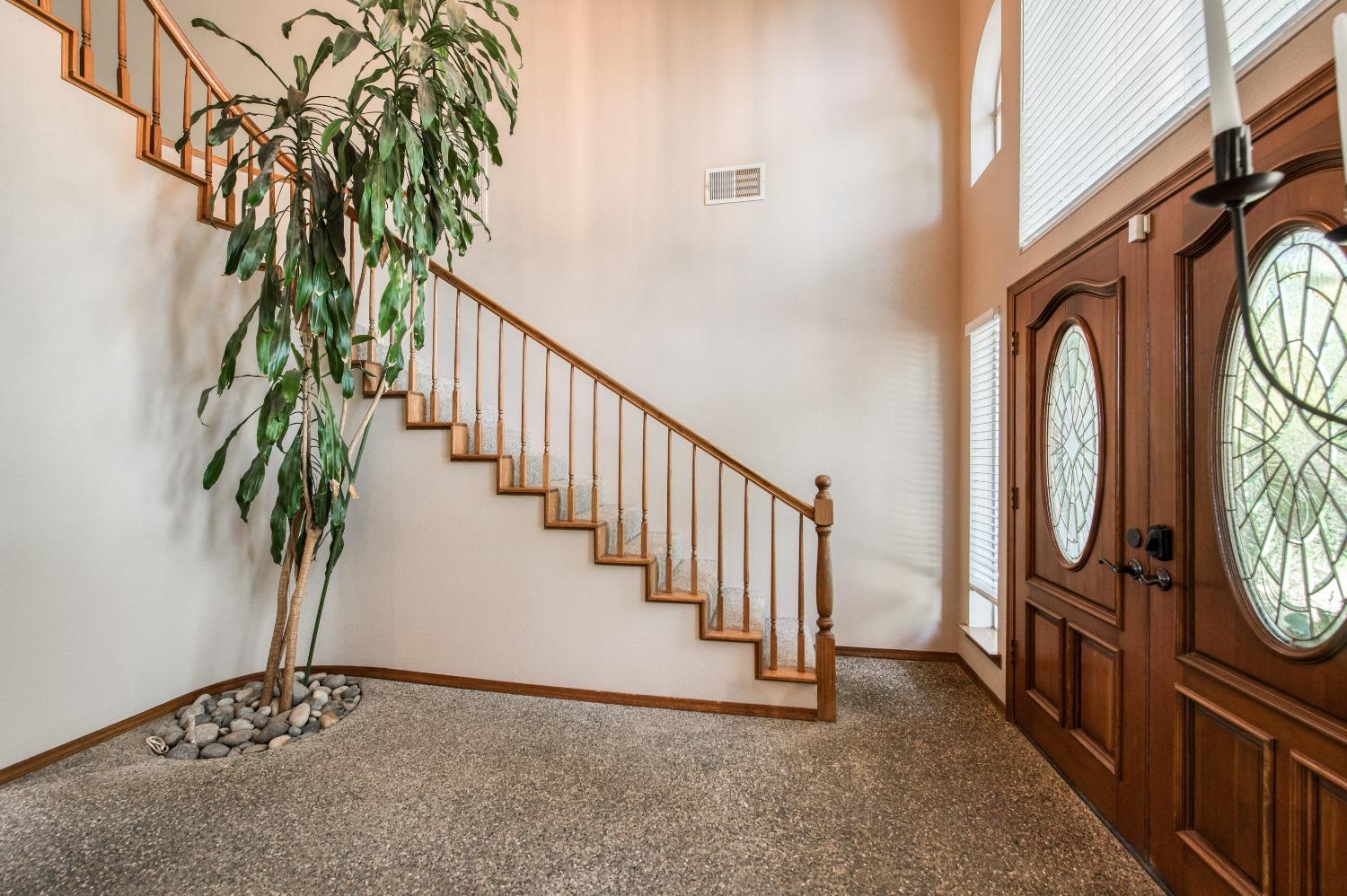 19408 Farallon Road Madera, CA 93638 - Photo 10 of 62 a view of a hallway with wooden floor and fence