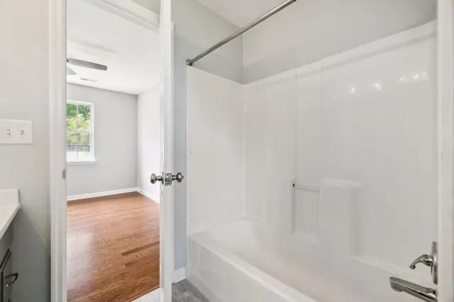 a view of an empty room with a window