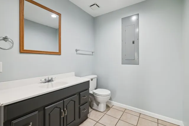 a view of a house with a yard and sitting area