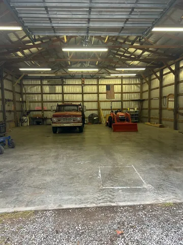 a view of a swimming pool with a yard