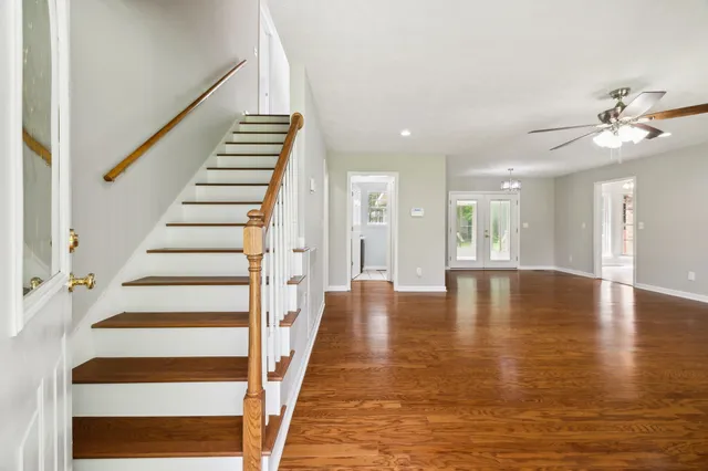 a view of an entryway with wooden floor