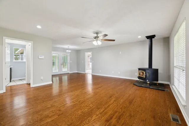 a view of a room with wooden floor