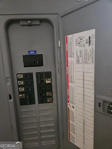 a bathroom with a shower and a sink