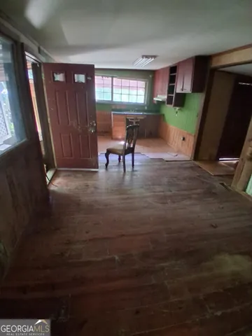 a view of a livingroom with furniture and a window