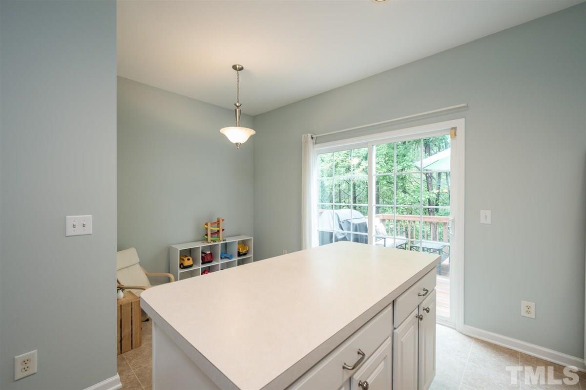 5414 Echo Ridge Road Raleigh, NC 27612 - Photo 11 of 22 a kitchen with a stove a refrigerator a sink and dishwasher