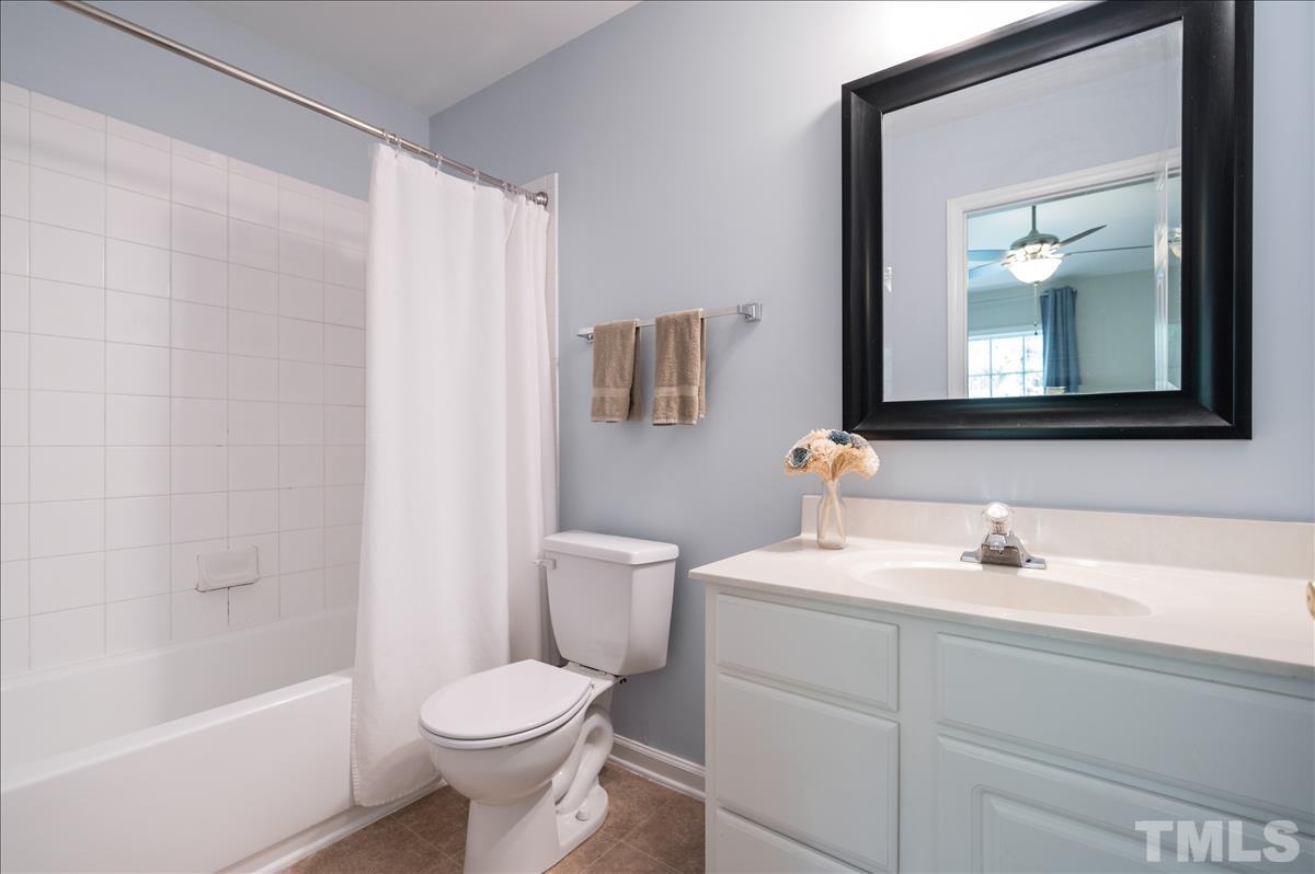 5414 Echo Ridge Road Raleigh, NC 27612 - Photo 13 of 22 a bathroom with a sink toilet and shower