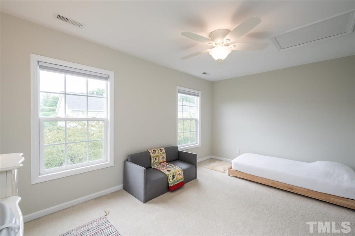 5414 Echo Ridge Road Raleigh, NC 27612 - Photo 14 of 22 a spacious bedroom with a bed and window