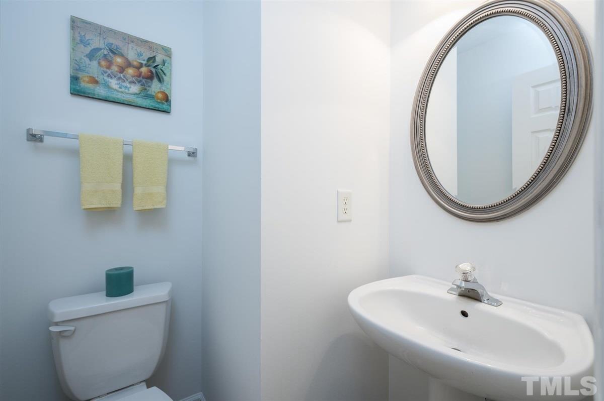 5414 Echo Ridge Road Raleigh, NC 27612 - Photo 16 of 22 a bathroom with a toilet and a sink
