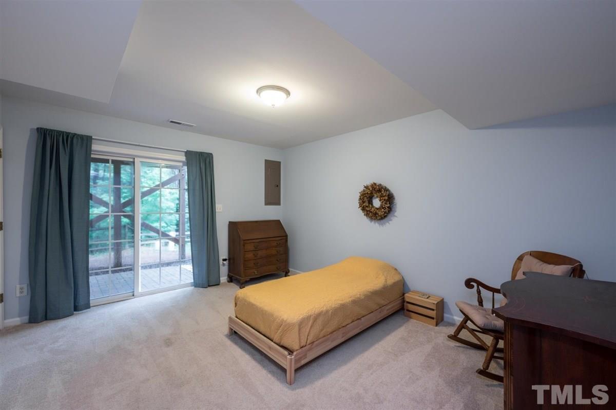 5414 Echo Ridge Road Raleigh, NC 27612 - Photo 17 of 22 a bedroom with a bed and window