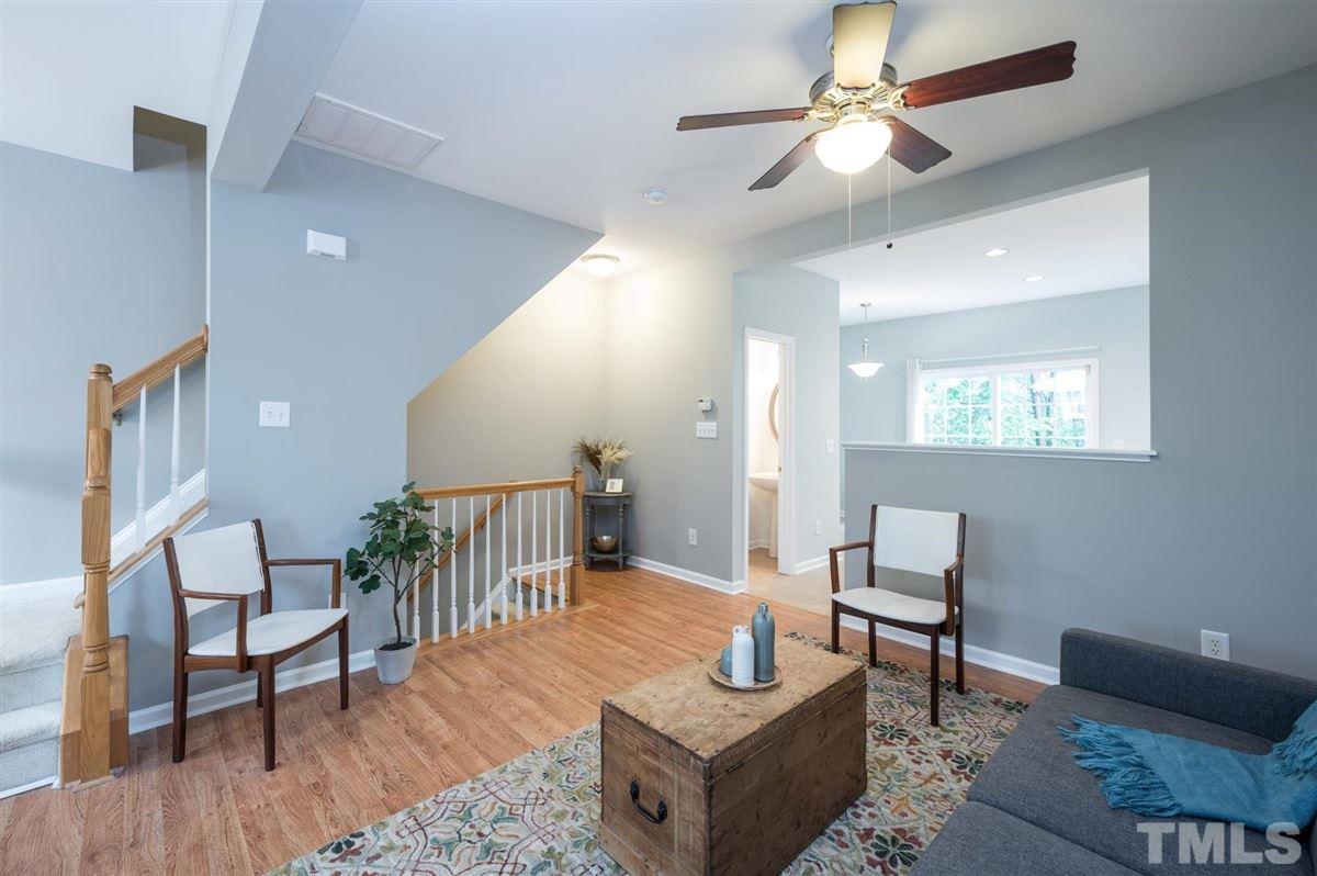 5414 Echo Ridge Road Raleigh, NC 27612 - Photo 5 of 22 a living room with furniture and a wooden floor