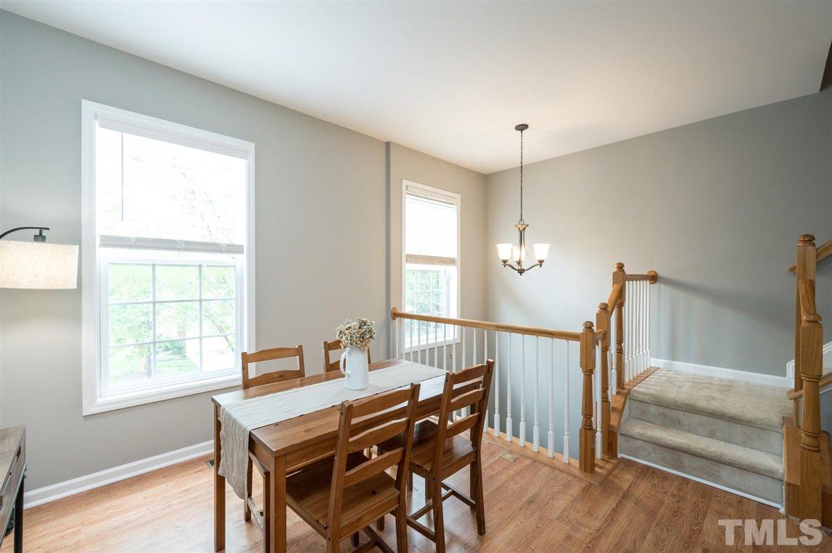 5414 Echo Ridge Road Raleigh, NC 27612 - Photo 6 of 22 a view of a dining room with furniture window and wooden floor