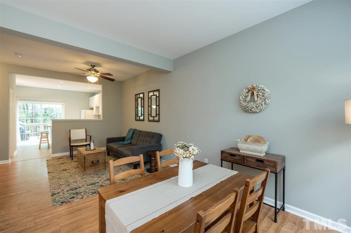 5414 Echo Ridge Road Raleigh, NC 27612 - Photo 7 of 22 a living room with furniture and wooden floor